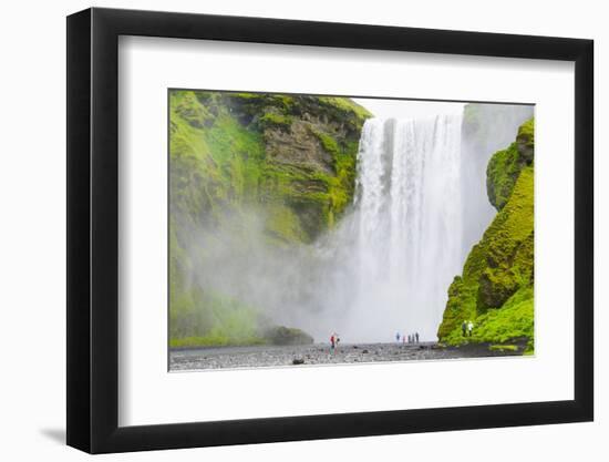 Iceland. South. Skogafoss. Hikers are Skogafoss Waterfall-Inger Hogstrom-Framed Photographic Print