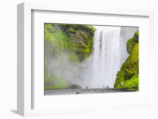 Iceland. South. Skogafoss. Hikers are Skogafoss Waterfall-Inger Hogstrom-Framed Photographic Print