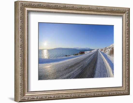 Icy coastal road with sun in winter, Buvik, Kvaloy, Troms, Norway-Raimund Linke-Framed Photographic Print