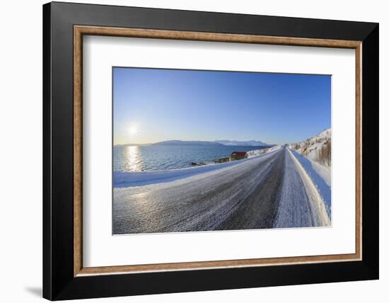 Icy coastal road with sun in winter, Buvik, Kvaloy, Troms, Norway-Raimund Linke-Framed Photographic Print