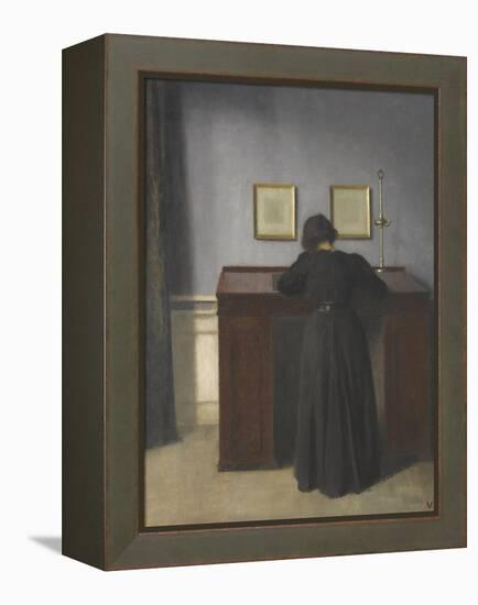 Ida Standing at a Desk-Vilhelm Hammershoi-Framed Premier Image Canvas