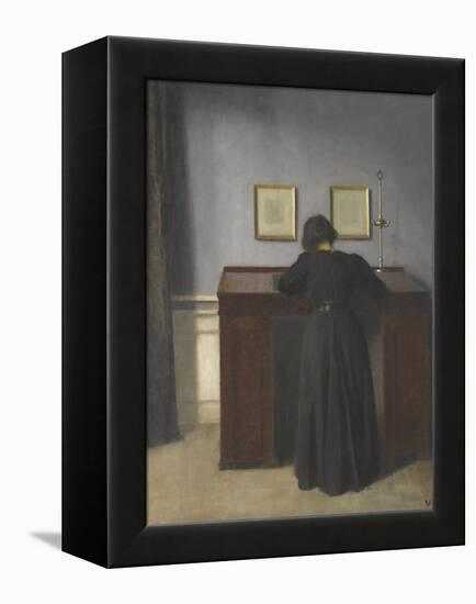 Ida Standing at a Desk-Vilhelm Hammershoi-Framed Premier Image Canvas