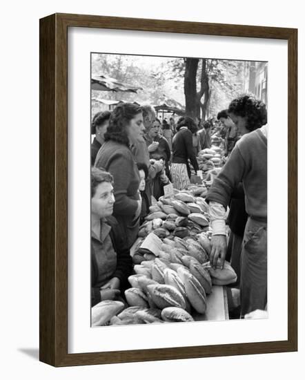 Illegal White Bread For Sale in Black Market-Alfred Eisenstaedt-Framed Photographic Print