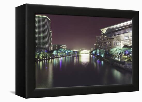 Illuminated architecture and reflections at night in Hangzhou City Center, Hangzhou, Zhejiang, Chin-Andreas Brandl-Framed Premier Image Canvas