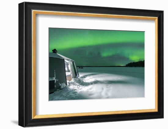 Illuminated empty igloo in the frozen landscape under Aurora Borealis (Northern Lights)-Roberto Moiola-Framed Photographic Print