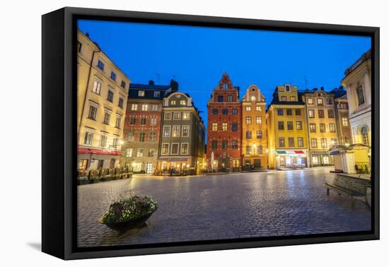 Illuminated historic buildings at dusk, Stortorget Square, Gamla Stan, Stockholm, Sweden-Roberto Moiola-Framed Premier Image Canvas