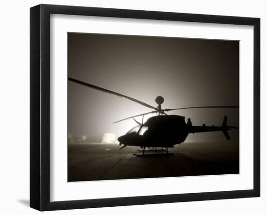 Illumination from the Bright Light Silhouettes of OH-58D Kiowa Helicopter During Thick Fog-Stocktrek Images-Framed Photographic Print