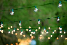 Hanging Decorative Christmas Lights For A Back Yard Party-imging-Mounted Photographic Print