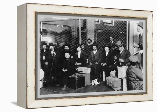 Immigrant Men Sitting at Ellis Island-null-Framed Stretched Canvas