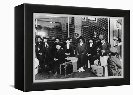 Immigrant Men Sitting at Ellis Island-null-Framed Stretched Canvas