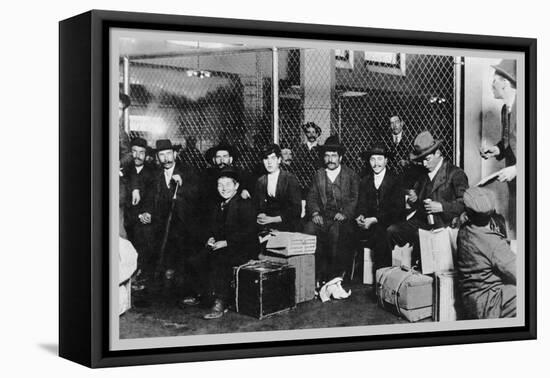 Immigrant Men Sitting at Ellis Island-null-Framed Stretched Canvas