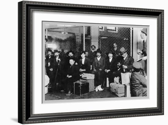 Immigrant Men Sitting at Ellis Island-null-Framed Premium Giclee Print