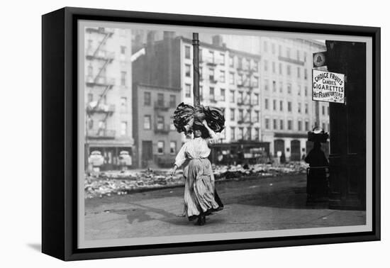 Immigrant Woman Walks Down Street Carrying a Pile of Clothing on Her Head-null-Framed Stretched Canvas