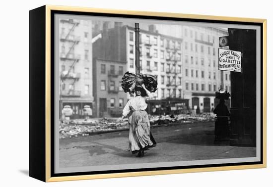 Immigrant Woman Walks Down Street Carrying a Pile of Clothing on Her Head-null-Framed Stretched Canvas