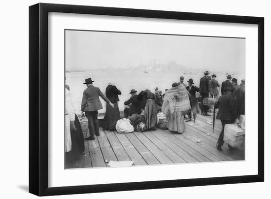 Immigrants Waiting for Ferry from Ellis Island to New York City, Oct. 20, 1912-null-Framed Photo