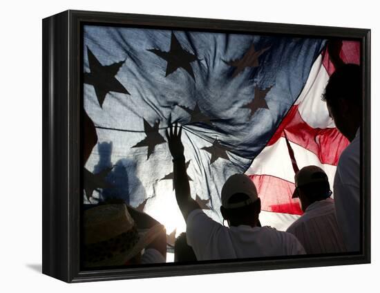 Immigration Rights Demonstrators Hold a U.S. Flag Aloft During a March Along Wilshire Boulevard-null-Framed Premier Image Canvas