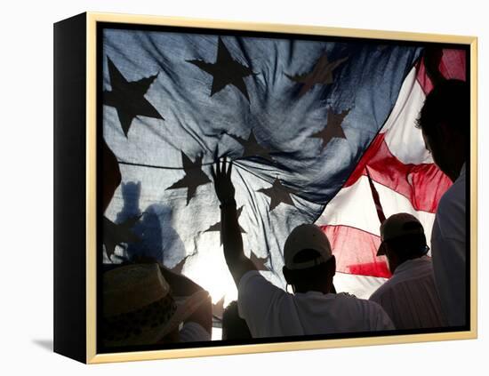 Immigration Rights Demonstrators Hold a U.S. Flag Aloft During a March Along Wilshire Boulevard-null-Framed Premier Image Canvas