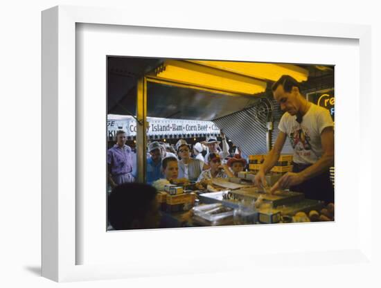 In a Booth at the Iowa State Fair, a Man Demonstrates 'Feemsters Famous Vegetable Slicer', 1955-John Dominis-Framed Photographic Print