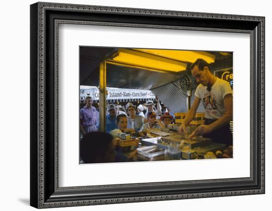 In a Booth at the Iowa State Fair, a Man Demonstrates 'Feemsters Famous Vegetable Slicer', 1955-John Dominis-Framed Photographic Print