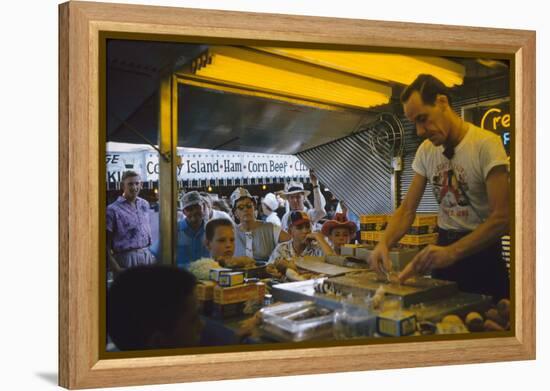 In a Booth at the Iowa State Fair, a Man Demonstrates 'Feemsters Famous Vegetable Slicer', 1955-John Dominis-Framed Premier Image Canvas