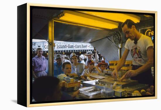 In a Booth at the Iowa State Fair, a Man Demonstrates 'Feemsters Famous Vegetable Slicer', 1955-John Dominis-Framed Premier Image Canvas