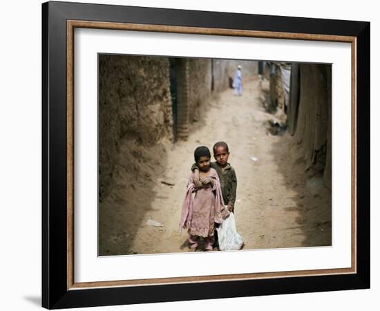 In an Alley While Waiting for the Rest of their Friends in a Poor Neighborhood in Pakistan-null-Framed Photographic Print