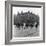 In Liverpool, a Lollipop Lady Helps Children Cross a Cobbled Street-Henry Grant-Framed Photographic Print