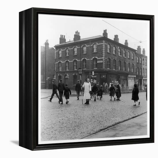 In Liverpool, a Lollipop Lady Helps Children Cross a Cobbled Street-Henry Grant-Framed Premier Image Canvas