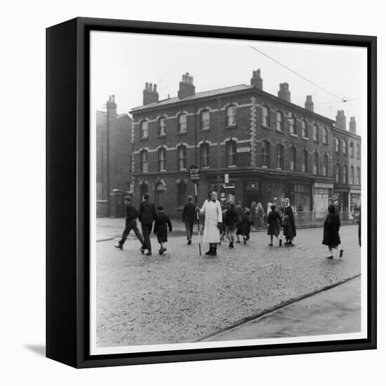 In Liverpool, a Lollipop Lady Helps Children Cross a Cobbled Street-Henry Grant-Framed Premier Image Canvas