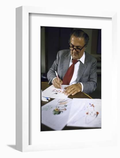 In Rome's Cinecitta Movie Center, Federico Fellini Draws for the Motion Picture "The Clowns"-Carlo Bavagnoli-Framed Photographic Print