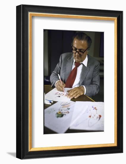 In Rome's Cinecitta Movie Center, Federico Fellini Draws for the Motion Picture "The Clowns"-Carlo Bavagnoli-Framed Photographic Print