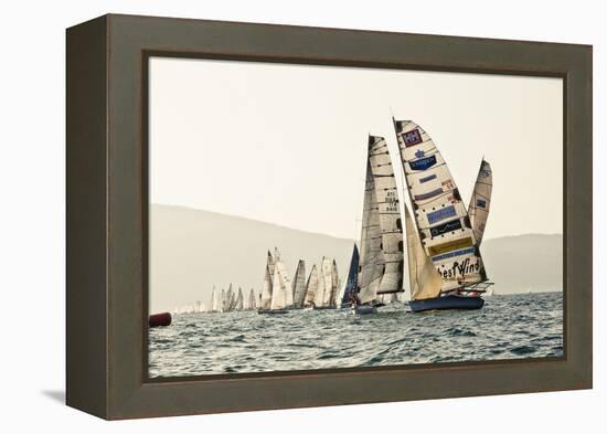 In the start of the yachting regatta Centomiglia in 2012 in front of the harbour of Bogliaco, Lake -Rasmus Kaessmann-Framed Premier Image Canvas