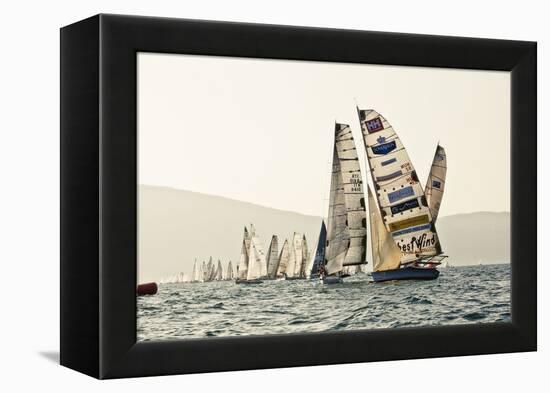 In the start of the yachting regatta Centomiglia in 2012 in front of the harbour of Bogliaco, Lake -Rasmus Kaessmann-Framed Premier Image Canvas