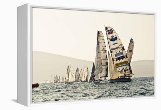 In the start of the yachting regatta Centomiglia in 2012 in front of the harbour of Bogliaco, Lake -Rasmus Kaessmann-Framed Premier Image Canvas
