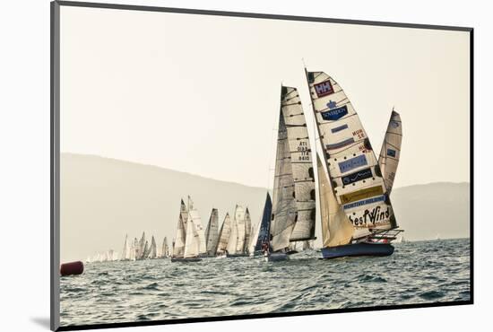 In the start of the yachting regatta Centomiglia in 2012 in front of the harbour of Bogliaco, Lake -Rasmus Kaessmann-Mounted Photographic Print