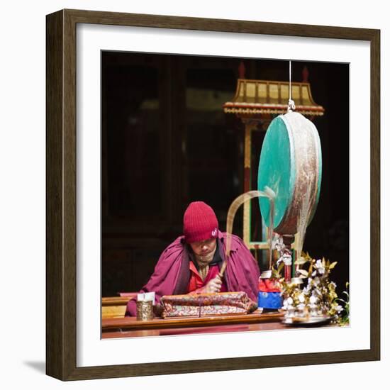 India, Ladakh, Hemis, Monk Reciting Prayers to the Slow Rhythm of a Drum at Hemis Monastery-Katie Garrod-Framed Photographic Print