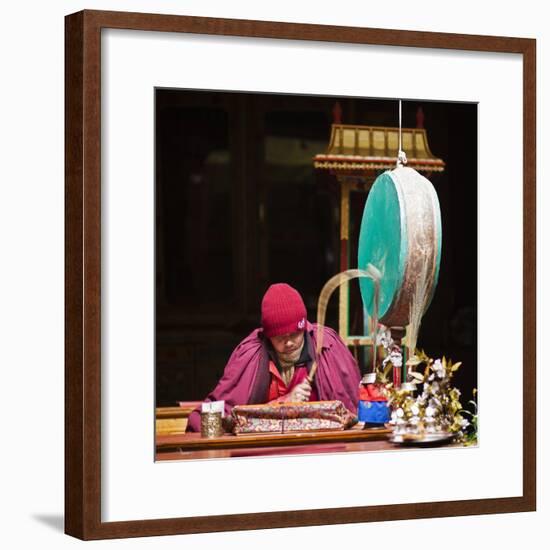 India, Ladakh, Hemis, Monk Reciting Prayers to the Slow Rhythm of a Drum at Hemis Monastery-Katie Garrod-Framed Photographic Print