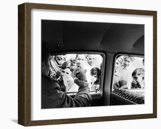 Indian children looking into puppeteer Bil Baird's car, March 1962.-James Burke-Framed Premium Photographic Print