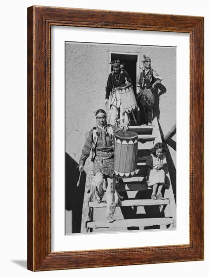 Indians Descending Wooden Stairs Carrying Drums, Dance San Ildefonso Pueblo New Mexico 1942-Ansel Adams-Framed Art Print