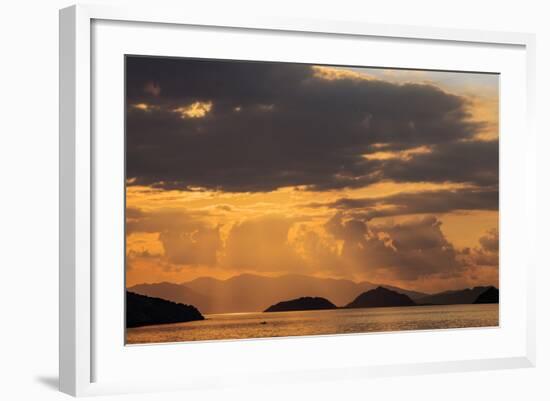 Indonesia, Lesser Sunda Islands, Rinca. Sunset over Komodo Island.-Nigel Pavitt-Framed Photographic Print