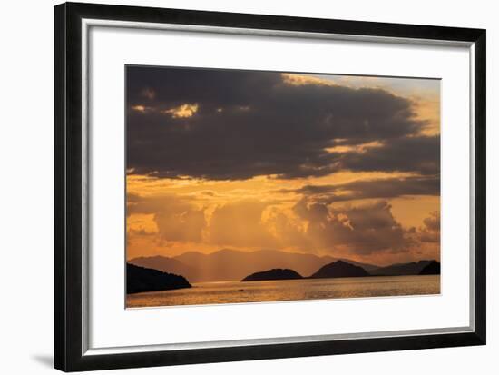 Indonesia, Lesser Sunda Islands, Rinca. Sunset over Komodo Island.-Nigel Pavitt-Framed Photographic Print