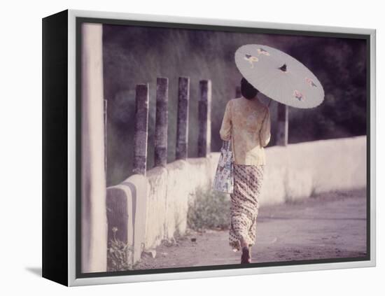 Indonesian Woman with a Parasol-Co Rentmeester-Framed Premier Image Canvas