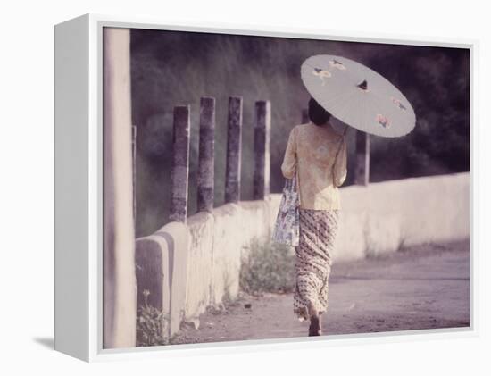 Indonesian Woman with a Parasol-Co Rentmeester-Framed Premier Image Canvas