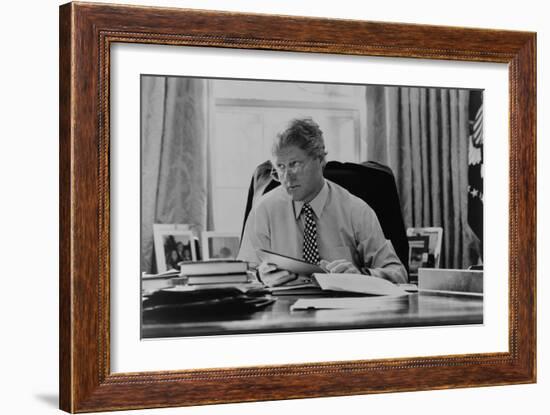 Informal Portrait of President Bill Clinton at His Desk in the Oval Office-null-Framed Premium Photographic Print