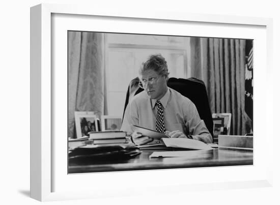 Informal Portrait of President Bill Clinton at His Desk in the Oval Office-null-Framed Premium Photographic Print