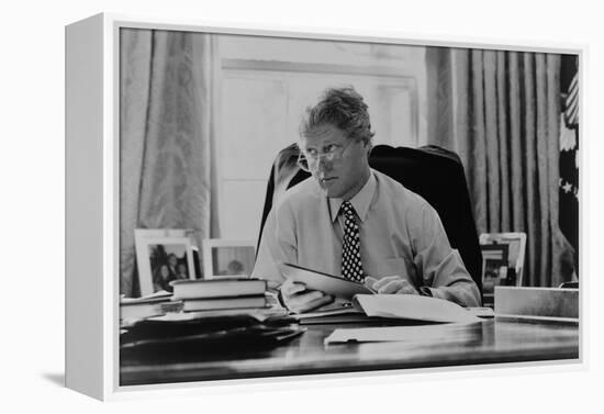 Informal Portrait of President Bill Clinton at His Desk in the Oval Office-null-Framed Stretched Canvas