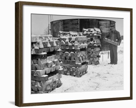 Ingot of Magnesium, Part of the U.S. Strategic Materials Stockpile, Stacked and Covered with Snow-Ed Clark-Framed Premium Photographic Print