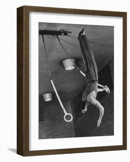 Intercollegiate Champion Gymnast Newt Loken on Flying Rings Doing Reverse Flyaway with Half Twist-Gjon Mili-Framed Photographic Print