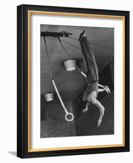 Intercollegiate Champion Gymnast Newt Loken on Flying Rings Doing Reverse Flyaway with Half Twist-Gjon Mili-Framed Photographic Print
