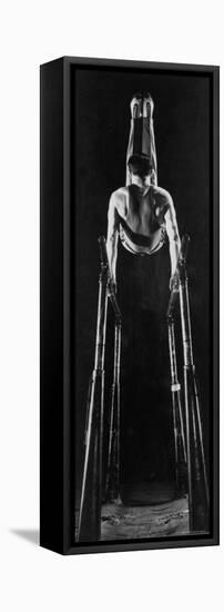 Intercollegiate Championship Gymnast Newt Loken Doing Back Somersault on Parallel Bars-Gjon Mili-Framed Premier Image Canvas